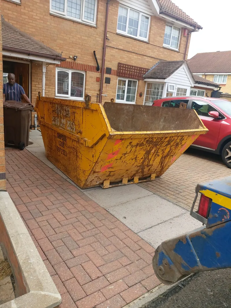 8-yard skip placed on residential driveway in Dagenham