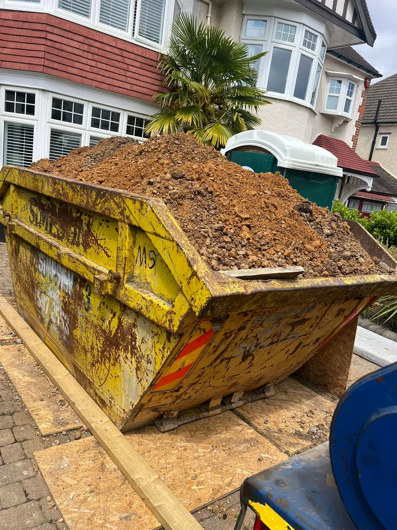 Full 8 yard skip filled with soil waste on Overton Drive, Romford